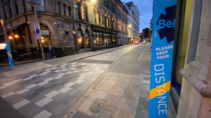 Empty street with Covid-19 signs during Lockdown 2 in Belfast, Northern Ireland